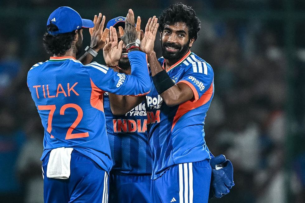 India's Jasprit Bumrah celebrates with teammates