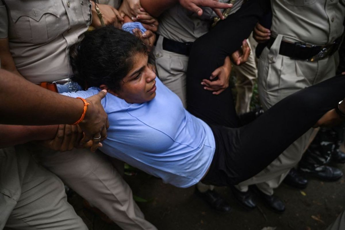 India's Olympic medal-winning wrestler Sakshi Malik is detained by the police while attempting to march to India's new parliament, just as it was being inaugurated by Prime Minister Narendra Modi, during a protest against Brij Bhushan Singh, the wrestling federation chief, over allegations of sexual harassment and intimidation, in New Delhi