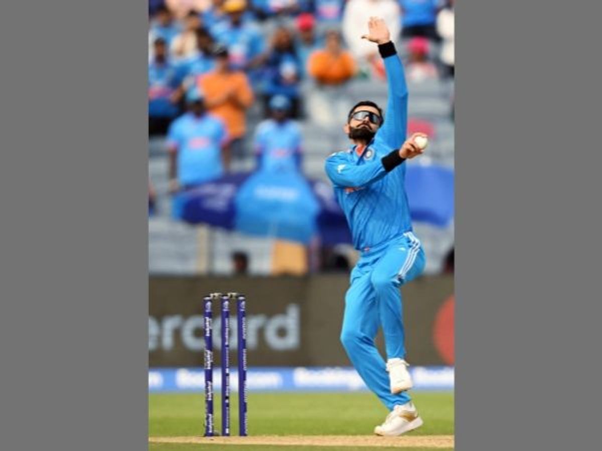 India's Virat Kohli bowls against Bangladesh in World Cup 2023