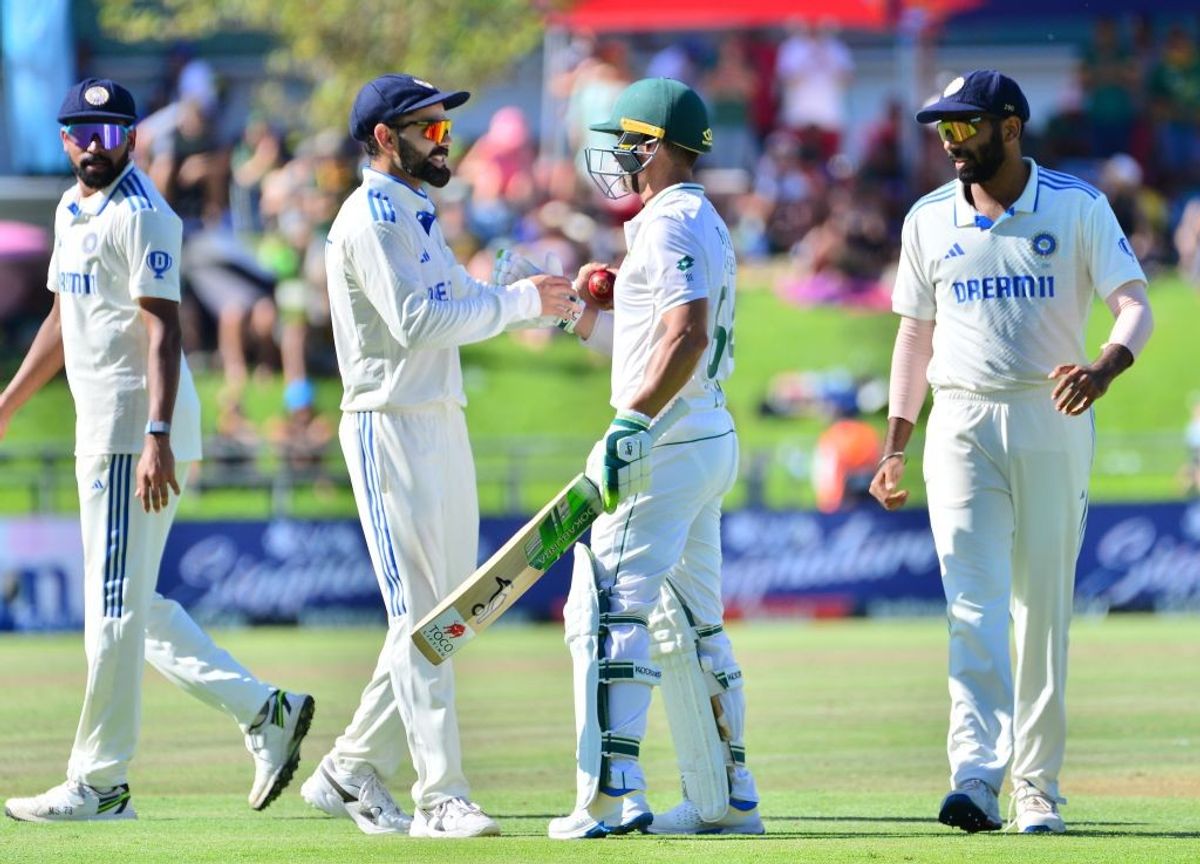India's Virat Kohli gives farewell to Dean Elgar after the South Africa batter gets out for the final time in Tests