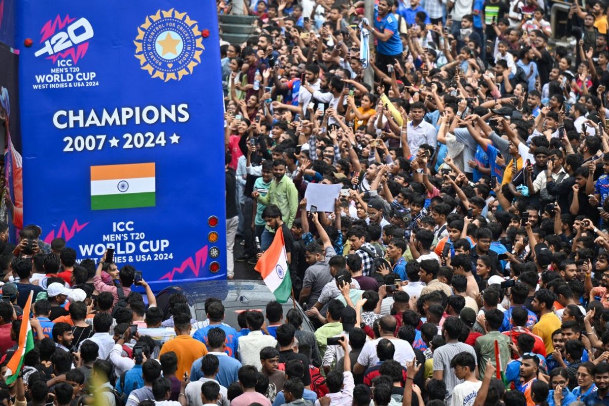 India's World Cup-winning team does victory parade in a blue open double-decker bus in Mumbai on July 4.