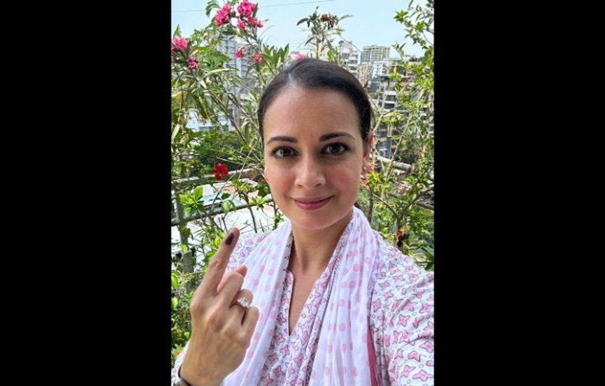 Indian actor Diya Mirza shows her ink-marked finger after casting her vote for the general elections in Mumbai in the western Indian state of Maharashtra