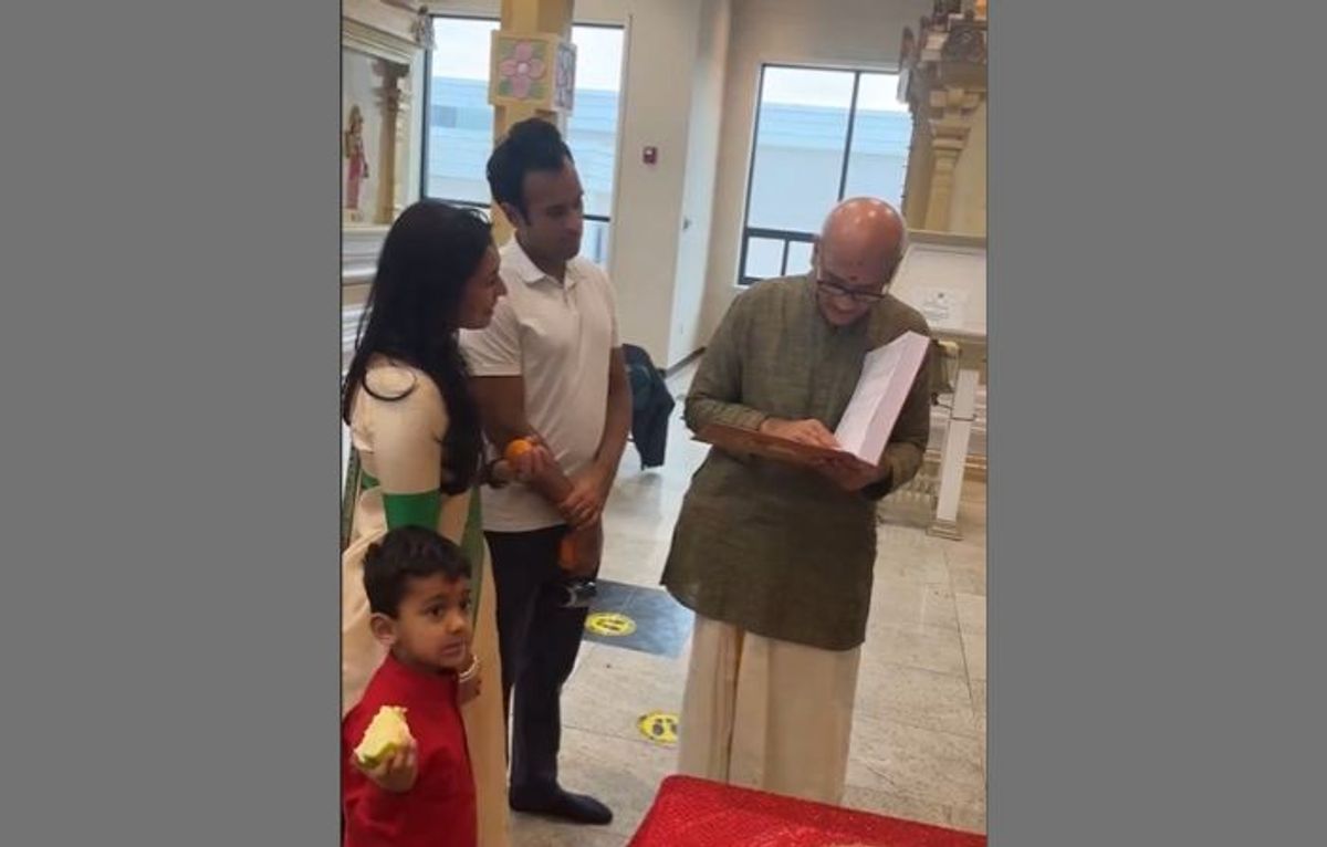 Indian-American presidential candidate Vivek Ramaswamy and his family watch as his father conducts a ceremonial puja of Rig Vedam at a temple in Dayton, Ohio