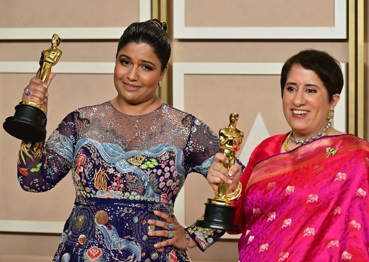Indian filmmaker Kartiki Gonsalves (L) and film producer Guneet Monga (R) pose with the Oscar for Best Short Subject Documentary for "The Elephant Whisperers" in the press room during the 95th Annual Academy Awards