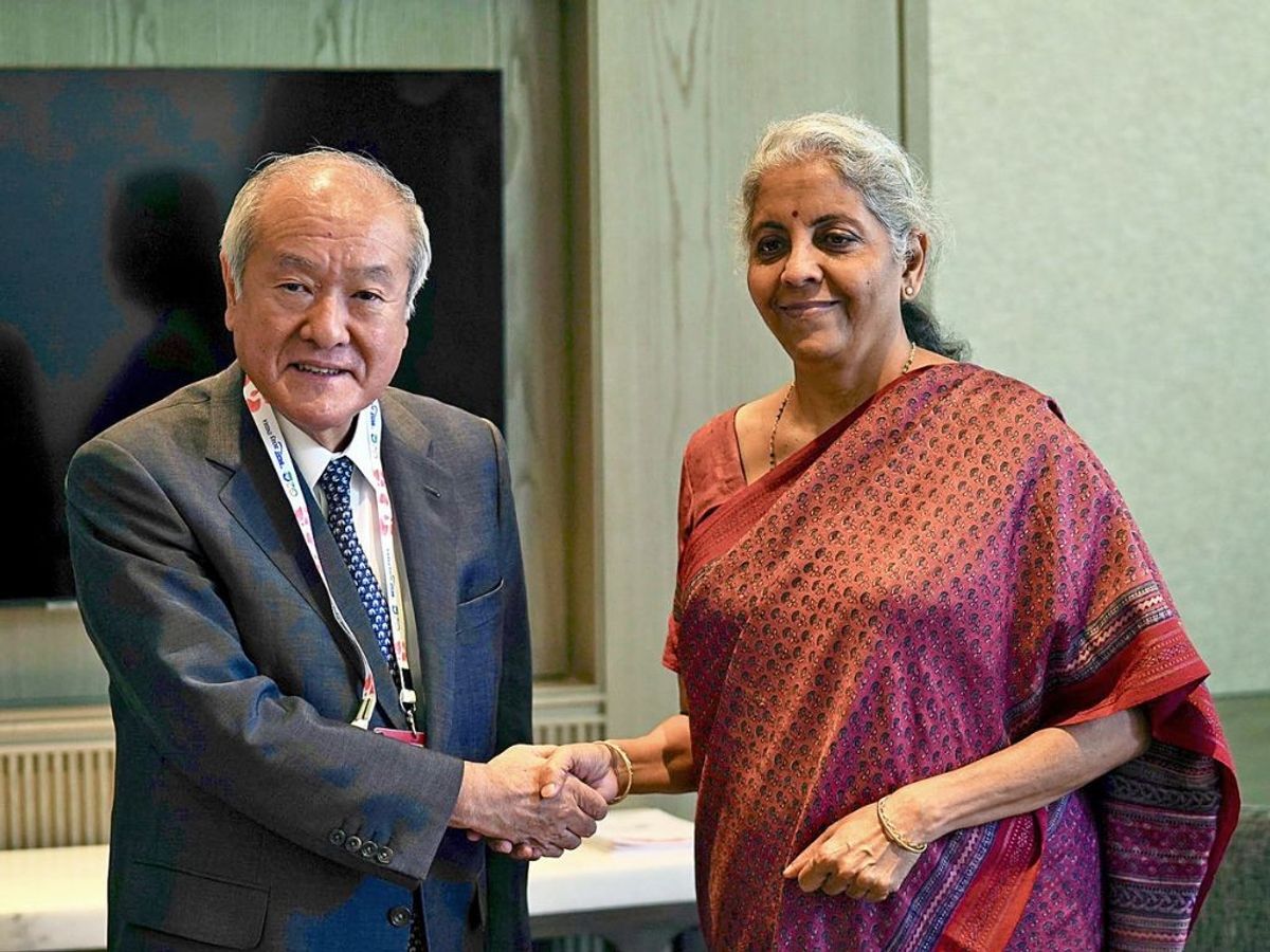 Indian finance minister Nirmala Sitharaman shakes hands with her Japanese counterpart Shunichi Suzuki