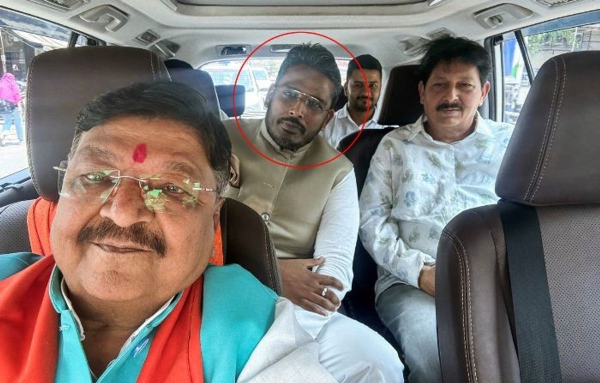 Indian National Congress's candidate Akshay Kanti Bam (shown in red circle) with a BJP leader