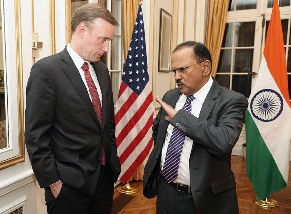 Indian national security advisor Ajit Doval (R) interacts with White House NSA to US president Jake Sullivan