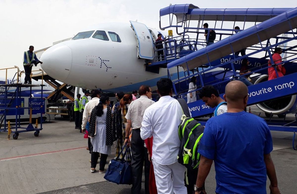 Indian passengers board an IndiGo plane at Indira Gandhi International Airport in New Delhi
