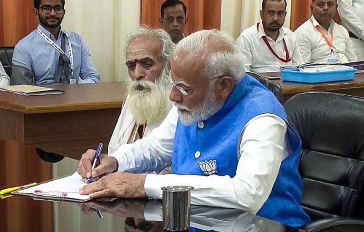 Indian PM Narendra Modi, accompanied by renowned astrology and Vedic scholar Ganeshwar Shastri Dravid, files his nomination papers for the upcoming general elections in Varanasi in the northern state of Uttar Pradesh