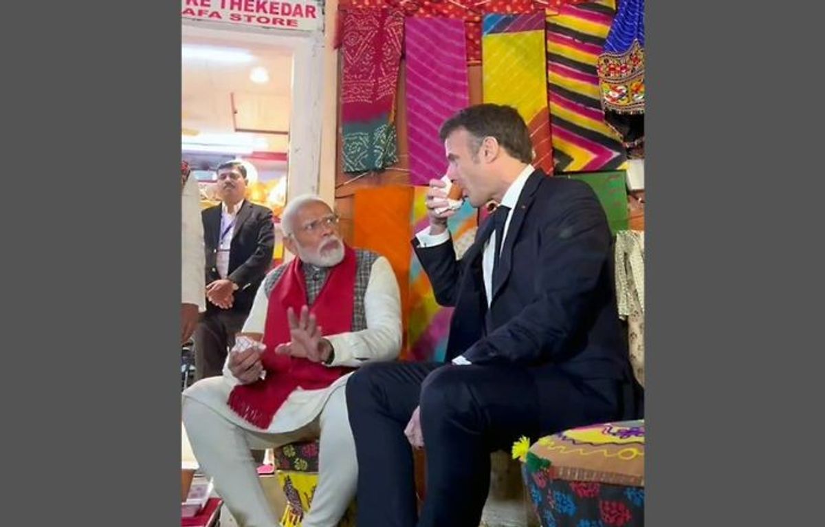 Indian PM Narendra Modi and French president Emmanuel Macron interact over tea
