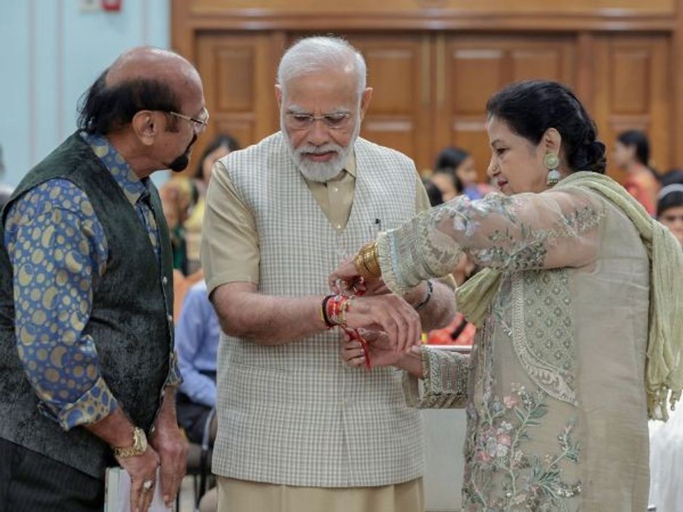 Indian PM Narendra Modi celebrates Raksha Bandhan in Delhi on August 30, 2023.