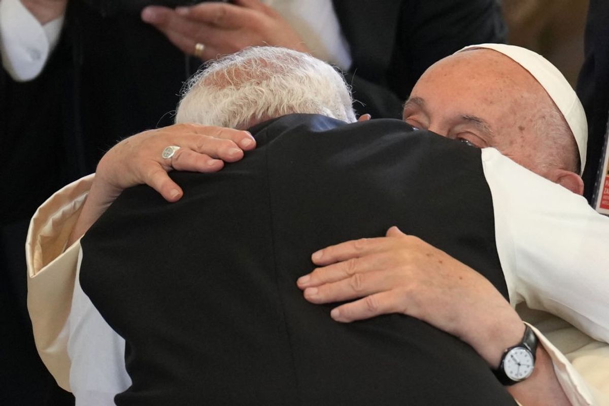 Indian PM Narendra Modi gives Pope Francis a warm hug at G7