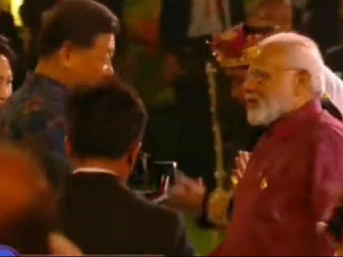 Indian PM Narendra Modi shakes hands with Chinese president Xi Jinping in Bali, Indonesia