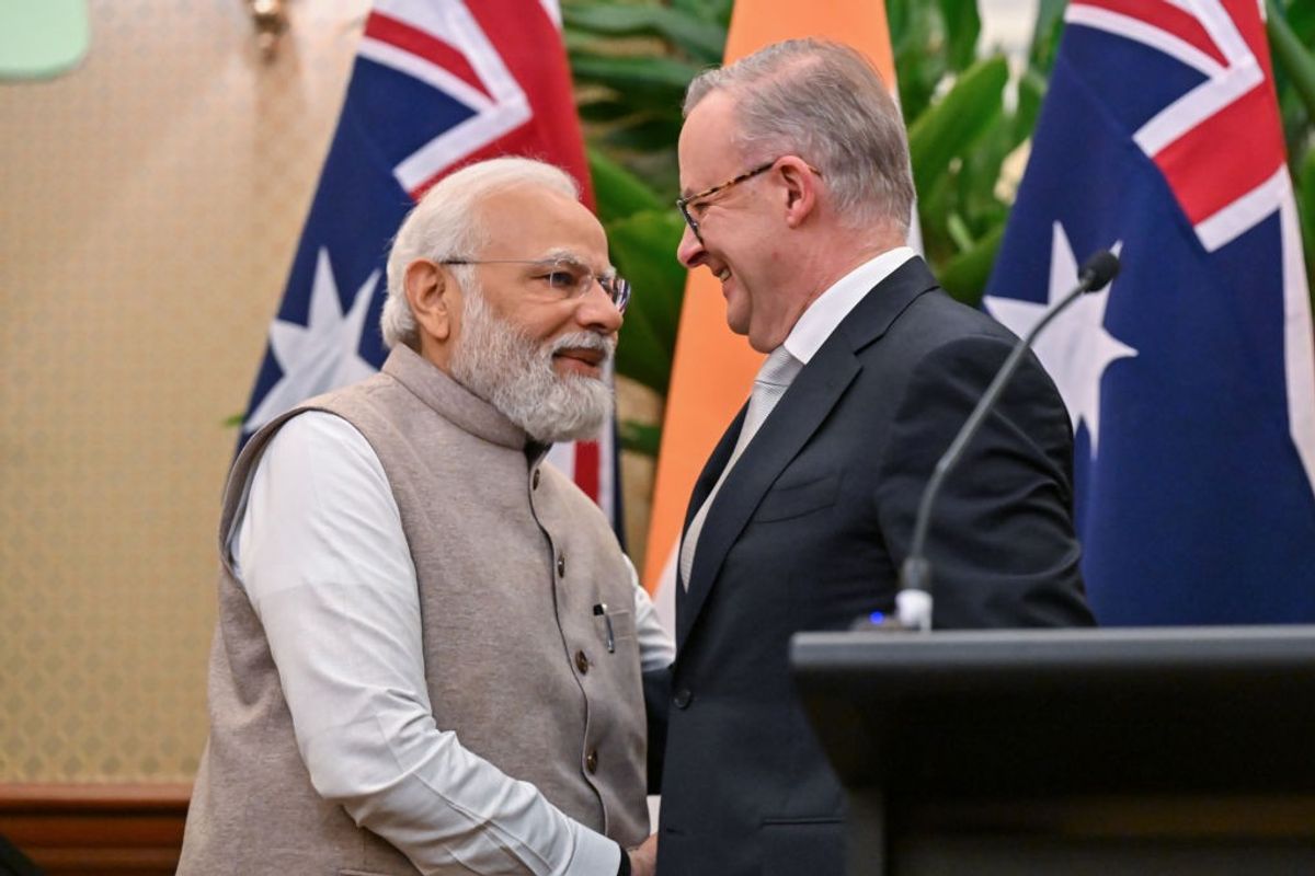 Indian PM Narendra Modi shakes hands with his Australian counterpart