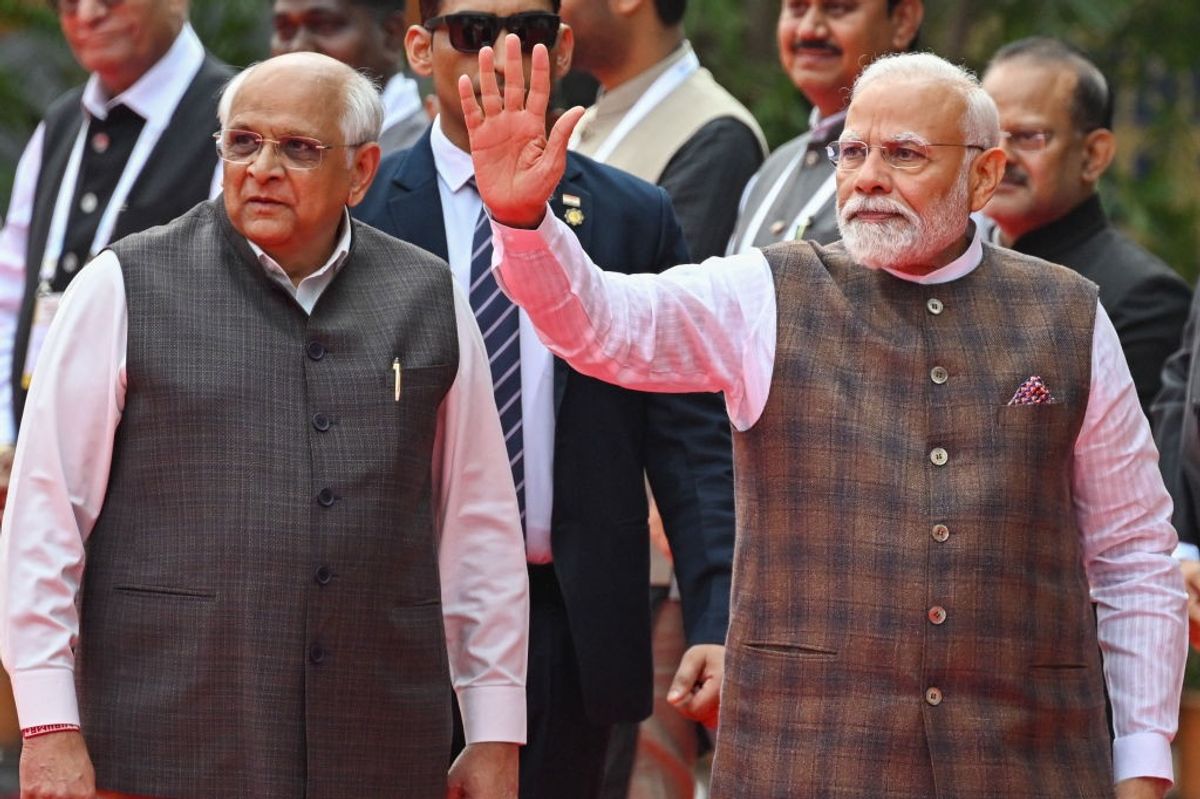 Indian PM Narendra Modi with Gujarat CM Bhupendra Patel (L)
