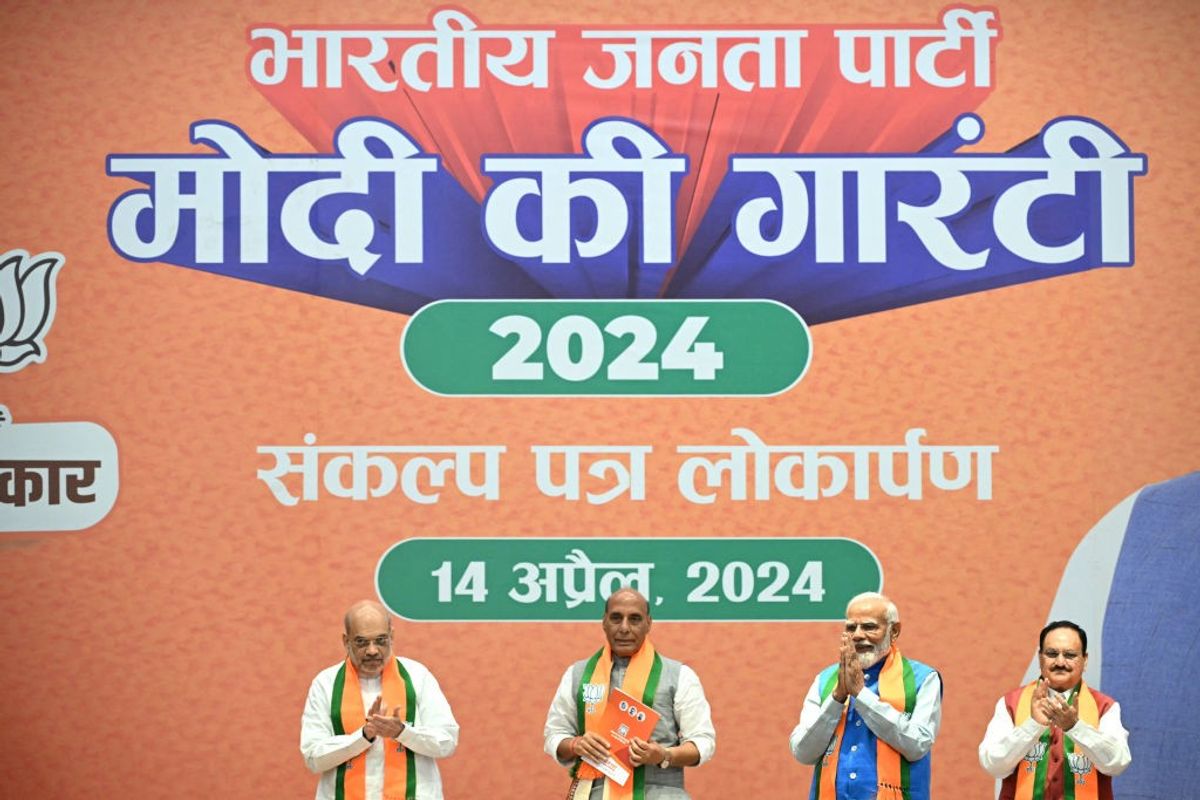Indian PM Narendra Modi with other ministers and the president of his BJP at the party's poll-manifesto release event.
