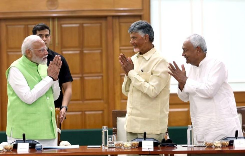 Indian PM Narendra Modi with two of his National Democratic Alliance allies N Chandrababu Naidu (C) and Nitish Kumar (R)