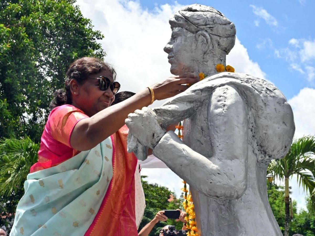Indian president Droupadi Murmu pays homage at the Baba and Mai monument, a symbolic representation of the first Indian man and woman, who set foot in Suriname as part of celebrations marking 150th anniversary of arrival of Indians in the South American country,