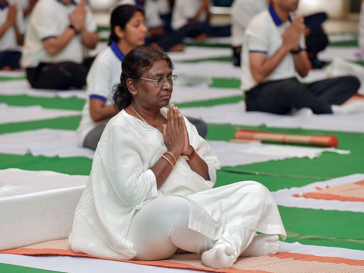 Indian president Droupadi Murmu performs yoga to mark International Day of Yoga at Rashtrapati Bhavan in New Delhi