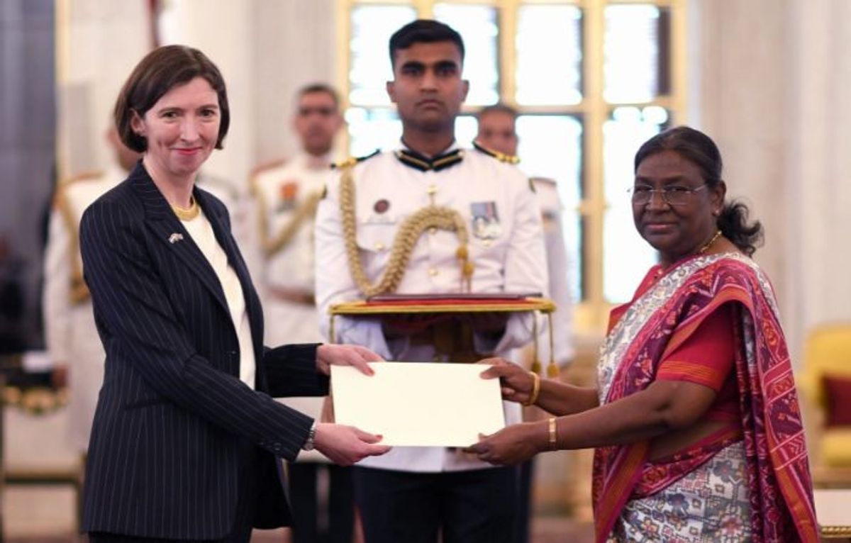 Indian president Droupadi Murmu (R) receives credentials from British high commissioner Lindy Cameron in New Delhi.