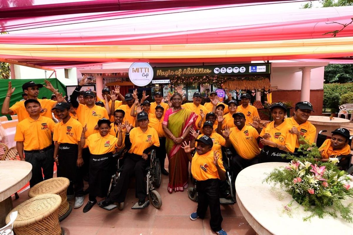 Indian president Droupadi Murmu with the employees of Mitti Cafe, which is run by people with special abilities, at Rashtrapati Bhavan in New Delhi