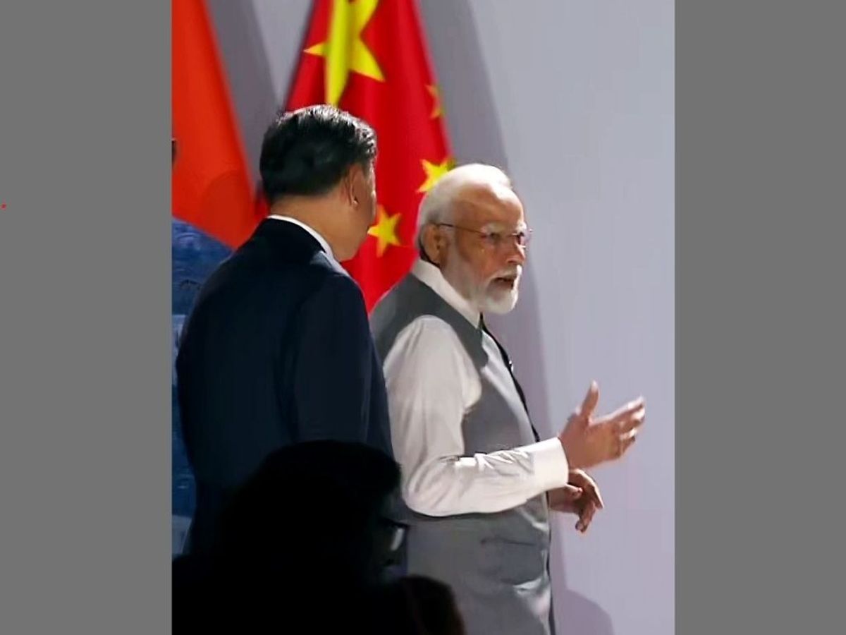 Indian prime minister Narendra Modi and Chinese president Xi Jinping engage in a brief interaction at the 15th BRICS Summit, in Johannesburg, South Africa,