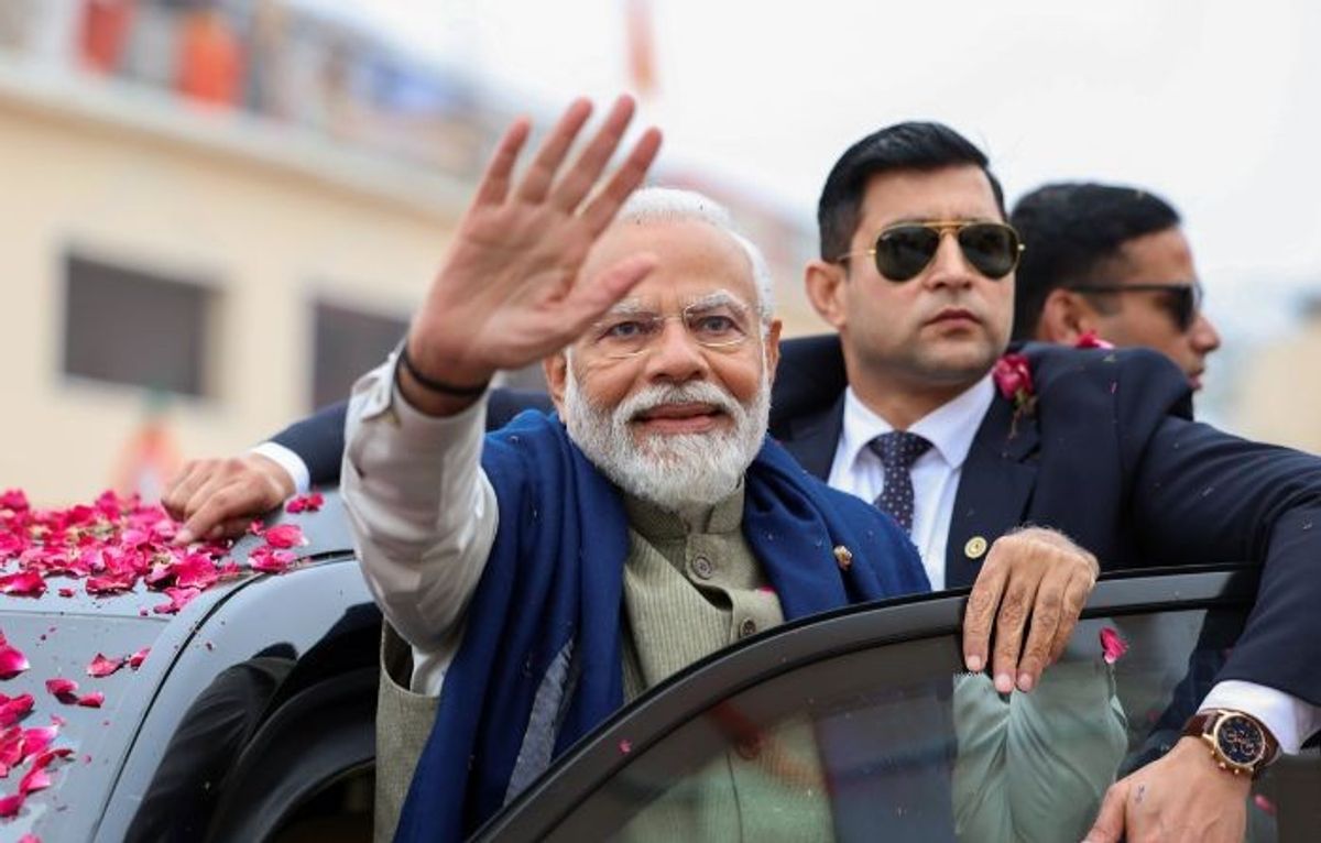 Indian prime minister Narendra Modi being waves hand at supporters in Ayodhya in the northern state of Uttar Prades