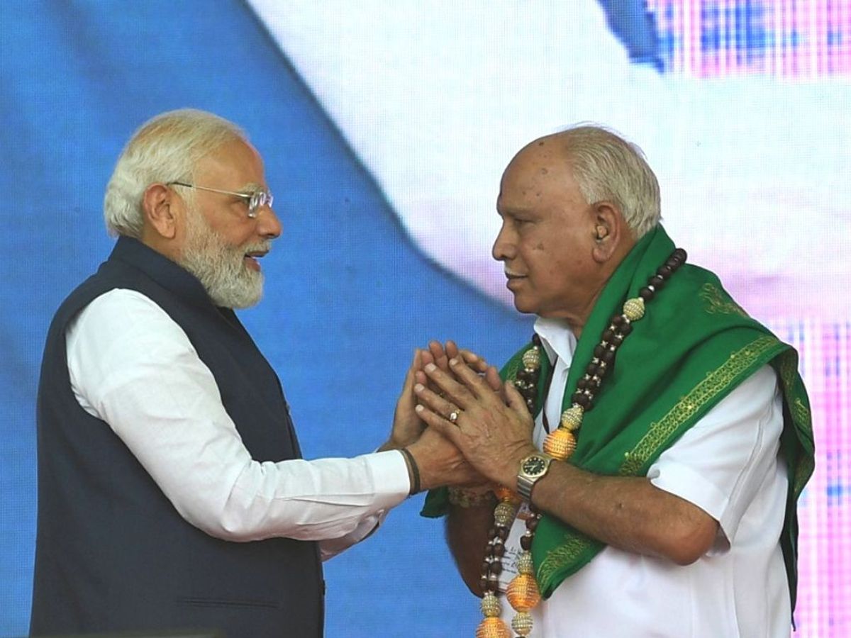 Indian prime minister Narendra Modi exchanges greetings with BS Yediyurappa, former chief minister of the southern Indian state of Karnataka, in the state's Shivamogga area