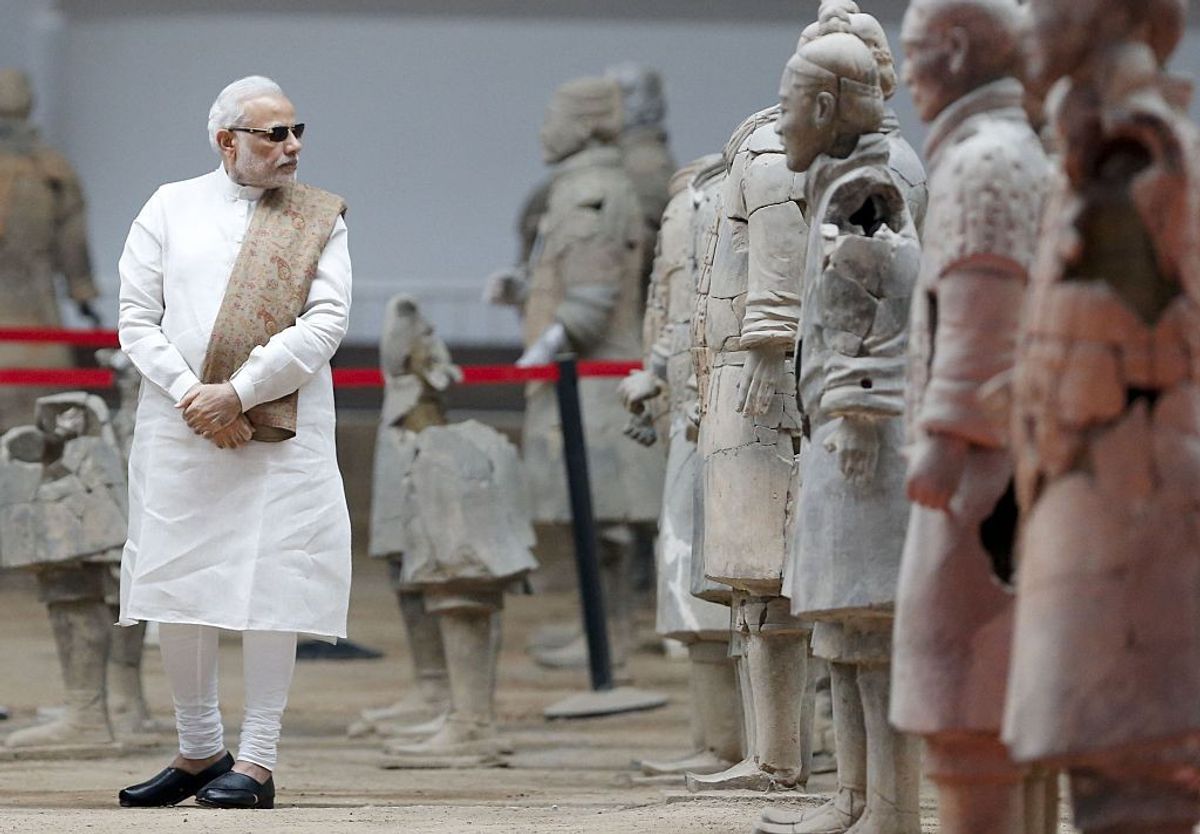 Indian prime minister Narendra Modi takes looks at sculptures of the Terracotta Army, a World Heritage Site, in the city of Xian in northwest China's Shaanxi province