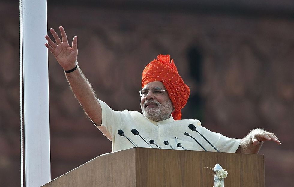 Indian prime minister Narendra Modi waves at the end of his speech from the Red Fort to mark the country's 68th Independence Day in New Delhi