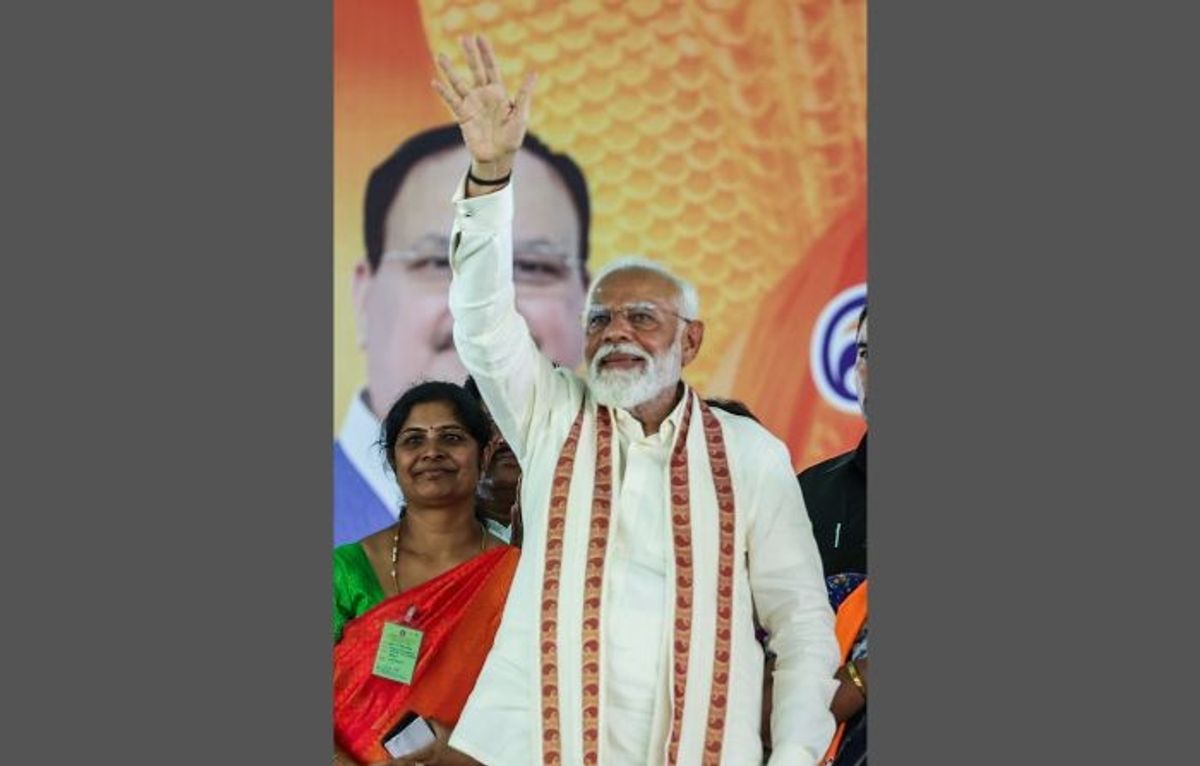 Indian prime minister Narendra Modi waves to the gathering during a public meeting ahead of the general elections, at Mettupalayam, in Coimbatore in the southern state of Tamil Nadu
