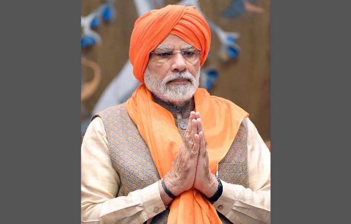 Indian prime minister Narendra Modi wears a Sikh turban while meeting a delegation from the community at his official residence in New Delhi