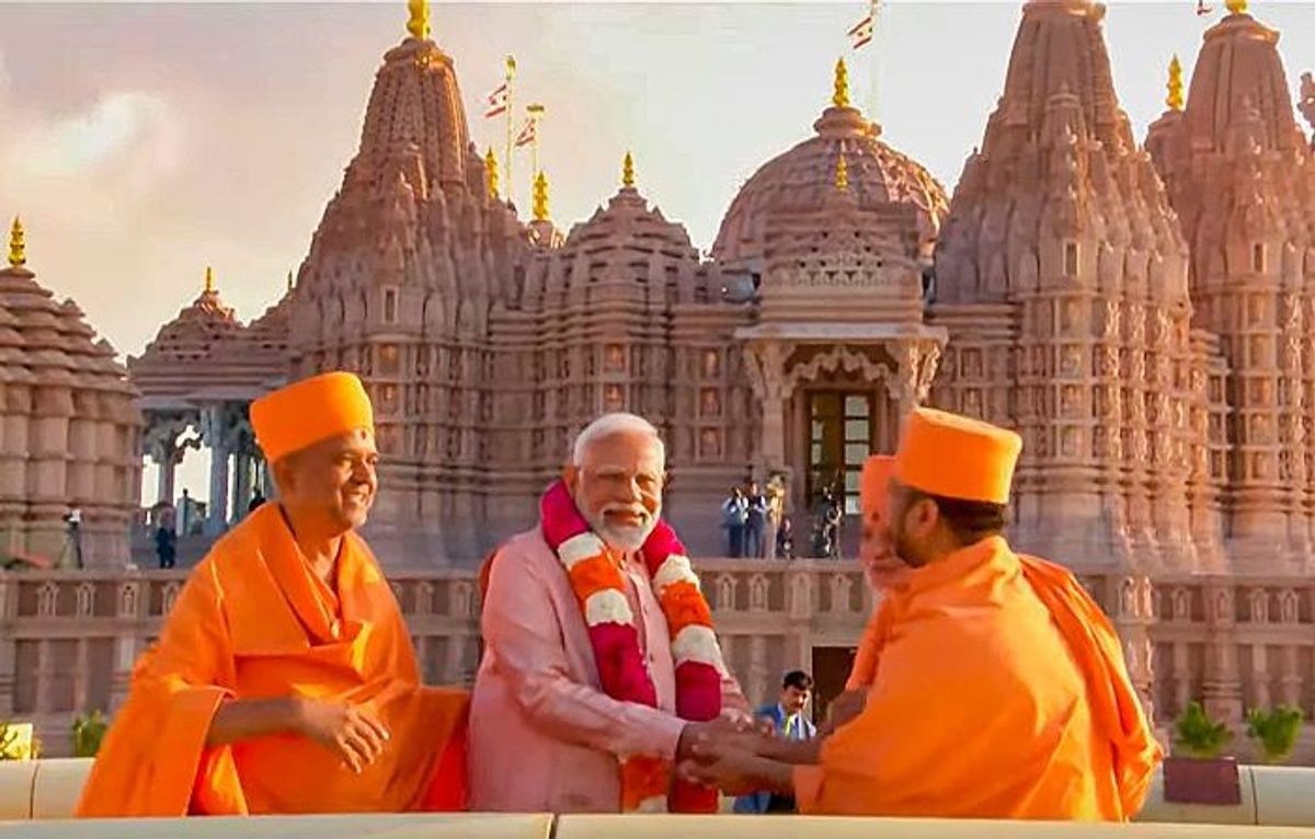 Indian prime minister with priests at the inauguration of the BAPS Hindu temple in Abu Dhabi, UAE.