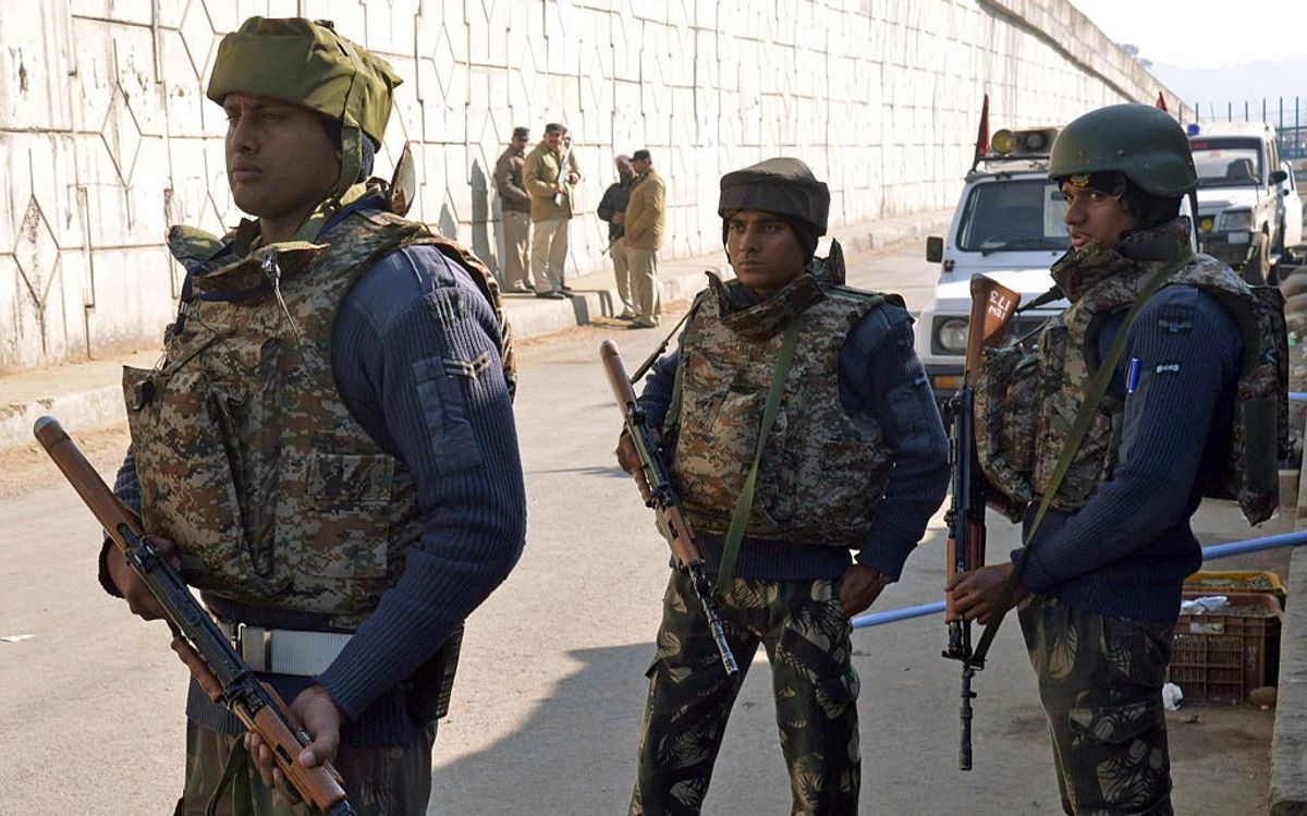 Indian security personnel stand alert on a road leading to an airforce base in Pathankot in the northern state of Punjab on January 2, 2016.