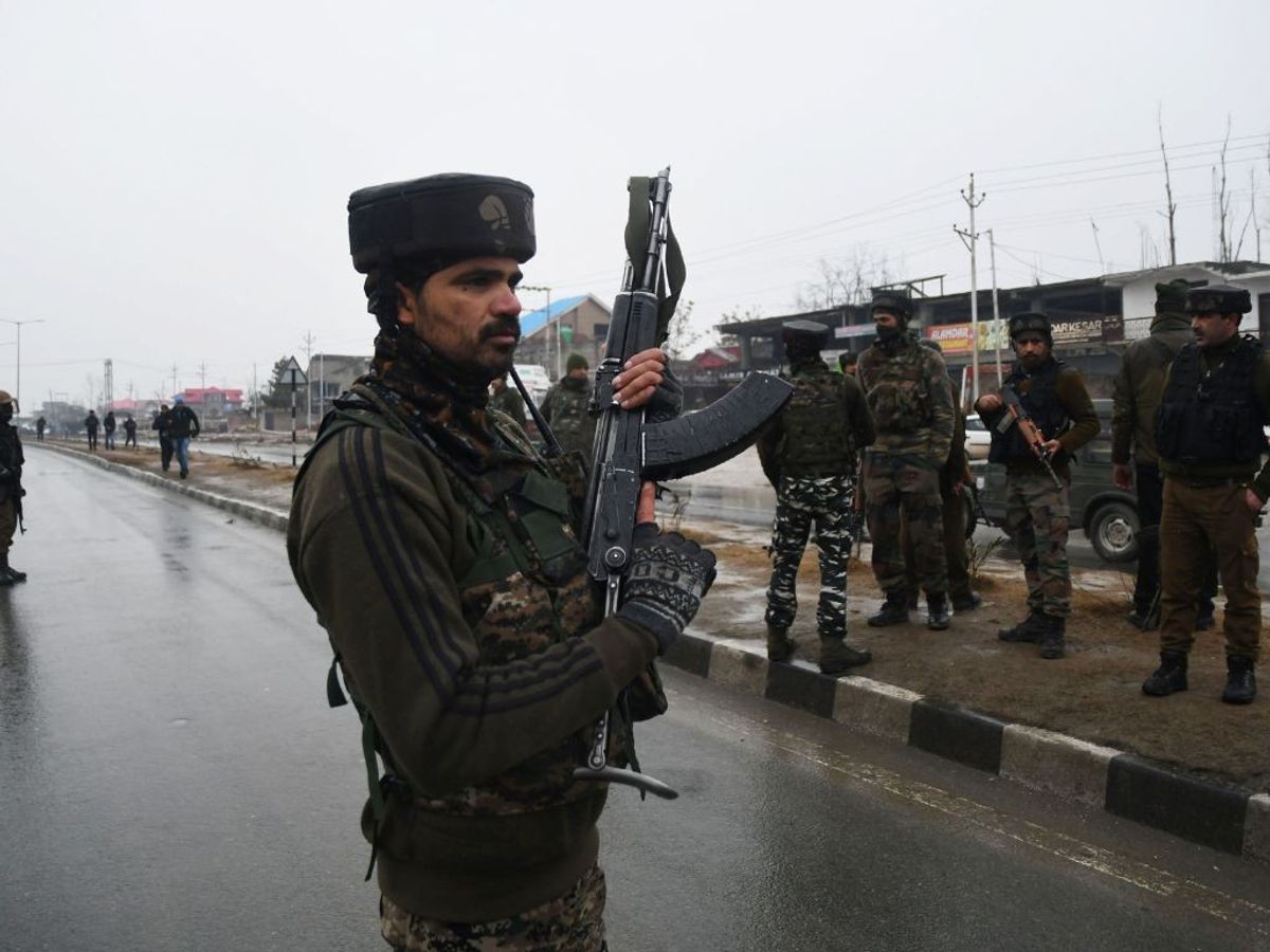 Indian soldiers stand guard at the site of an explosion in Pulwama district of Jammu and Kashmir in February 2019