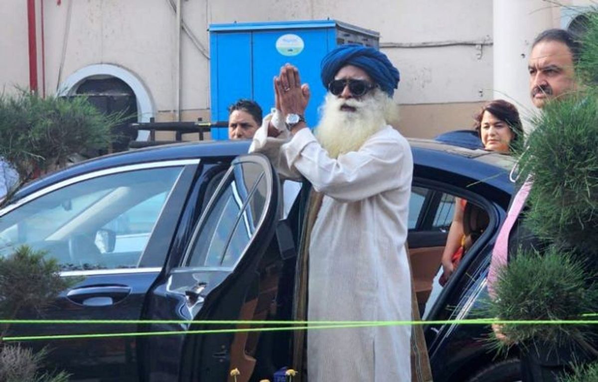 Indian spiritual leader Sadhguru Jaggi Vasudev acknowledges supporters after being discharged from the Indraprastha Apollo Hospital after a brain surgery, in New Delhi