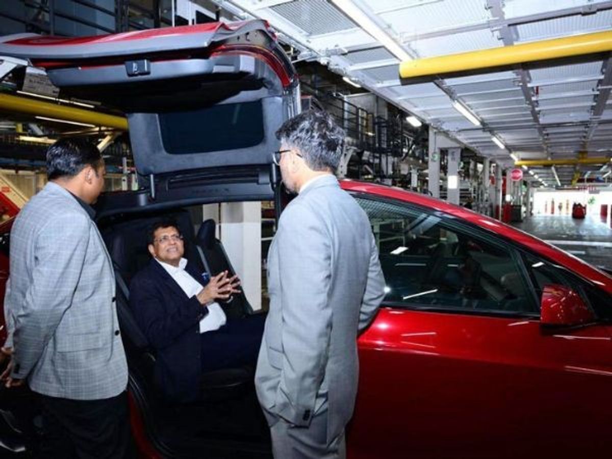 Indian trade minister Piyush Goyal (seated) at Tesla's manufacturing facility in Fremont, California, US.