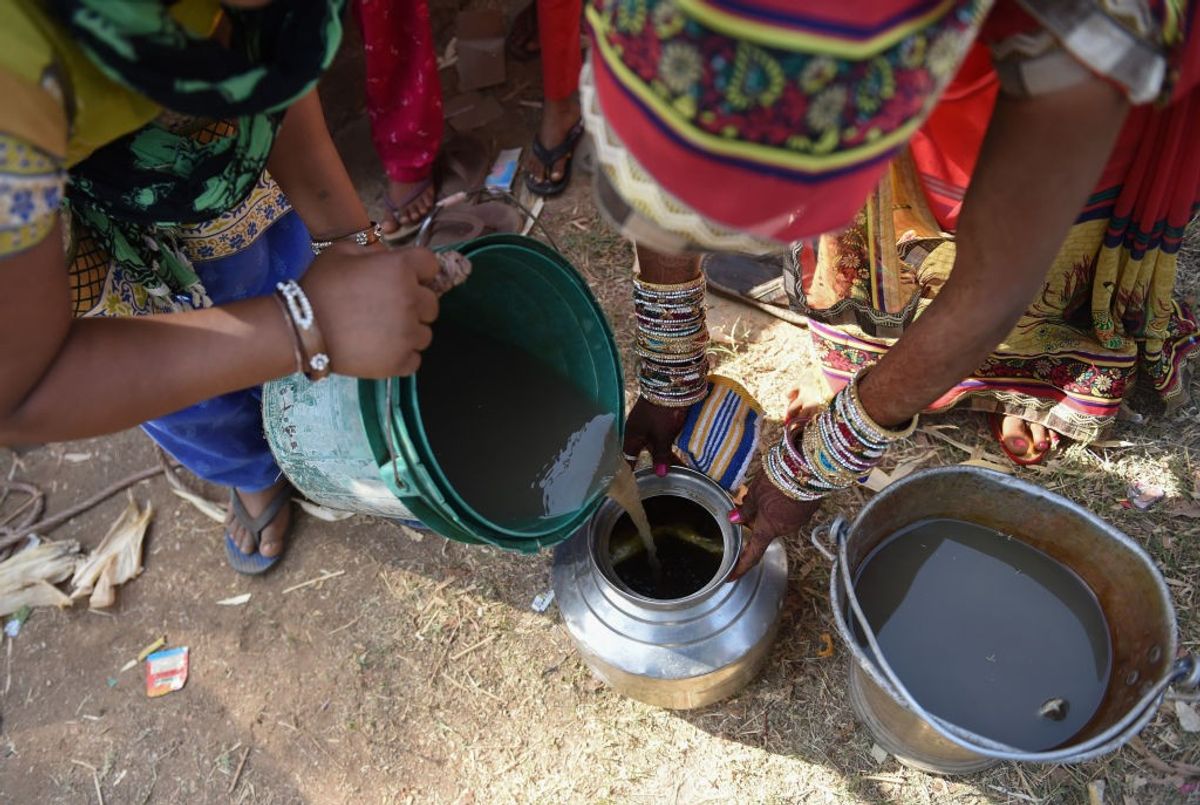 Indian villagers fetch water