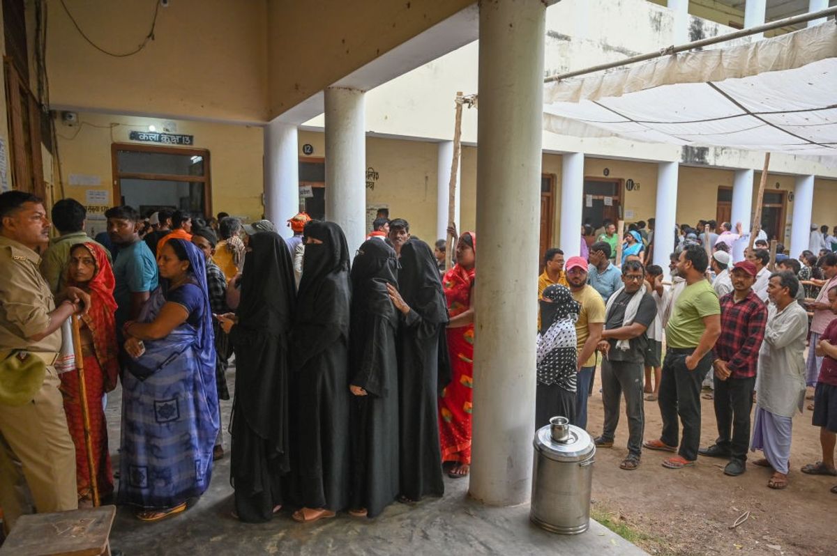 Indian voters queue up at an election polling centre