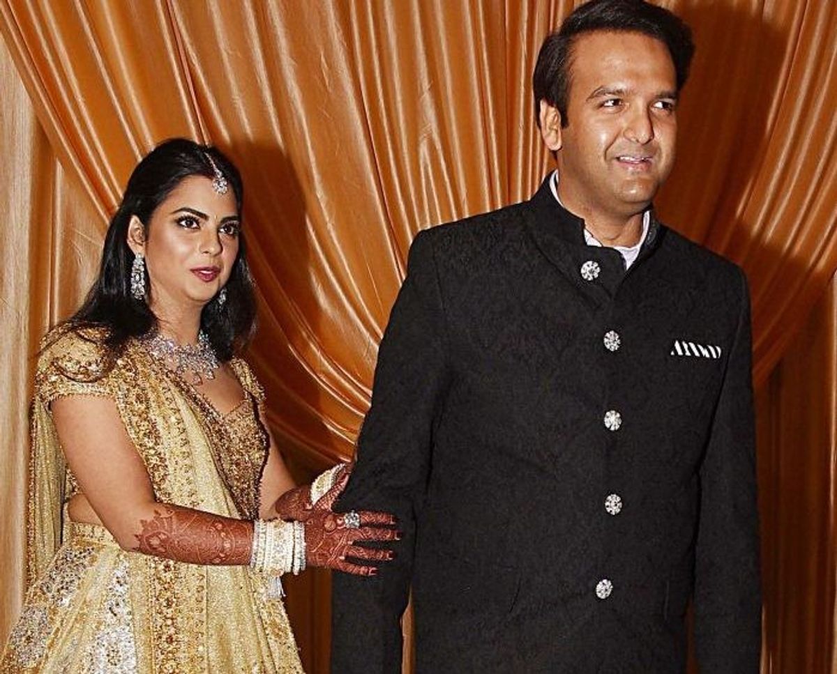 Isha Ambani & Anand Piramal Take Holy Dip at Maha Kumbh 2025