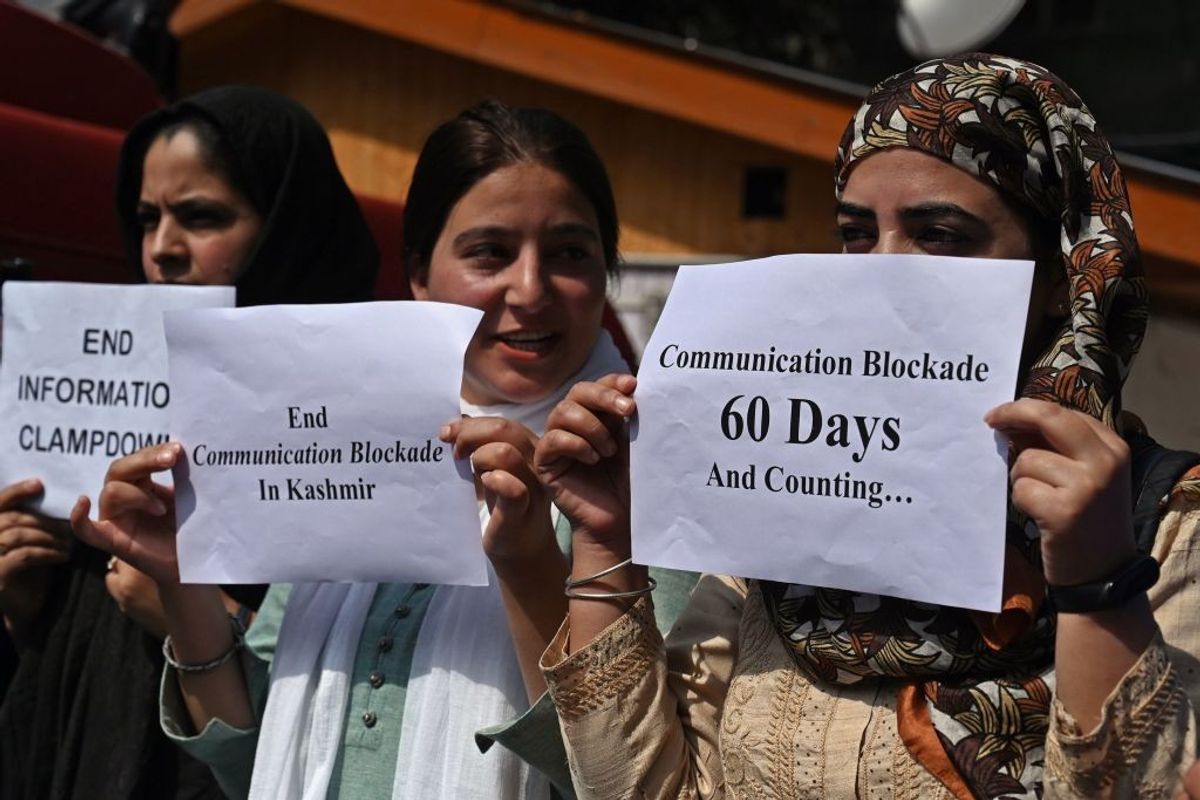 Journalists hold signs during a protest against restrictions of the Internet and mobile phone networks at the Kashmir Press Club during a lockdown in Srinagar in Kashmir, India.