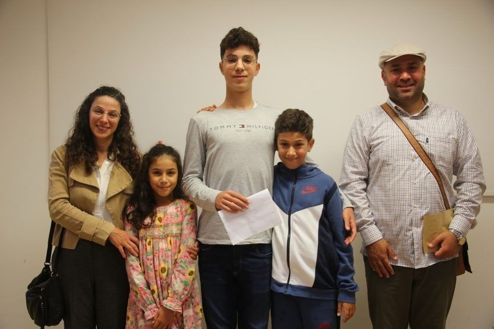 Kassem with proud family
