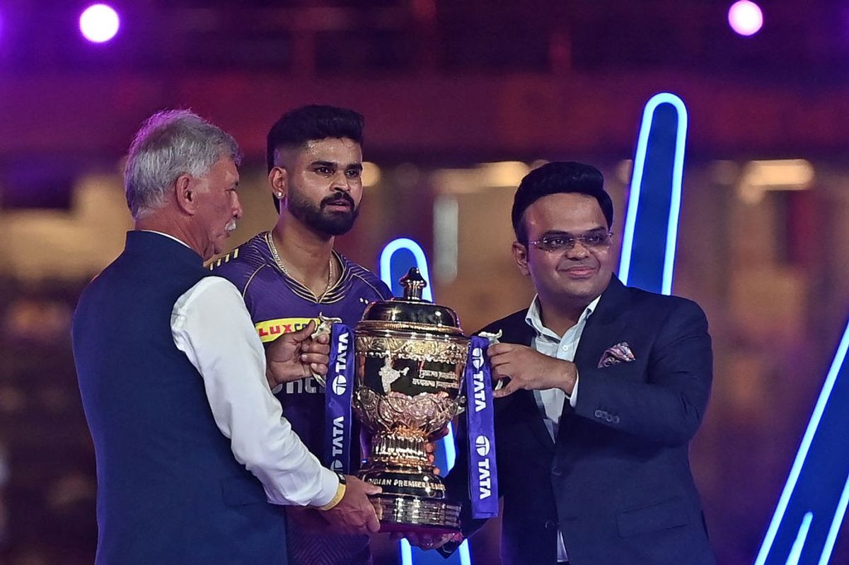 KKR captain Shreyas Iyer (c) receive the Indian Premier League trophy from Indian cricket board president Roger Binny (L) and secretary Jay Shah