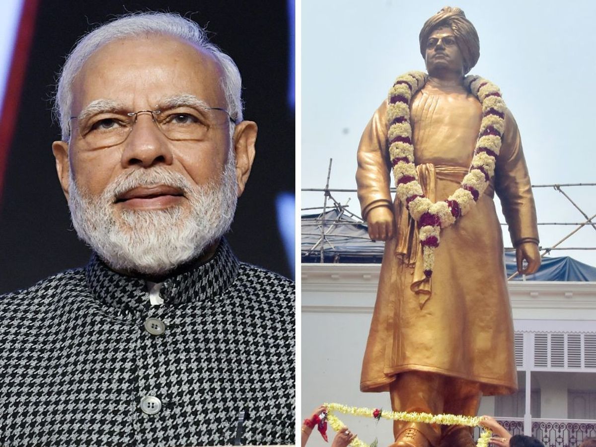 (L-R) Indian prime minister Narendra Modi and a statue of Swami Vivekananda, one of India's youth icons