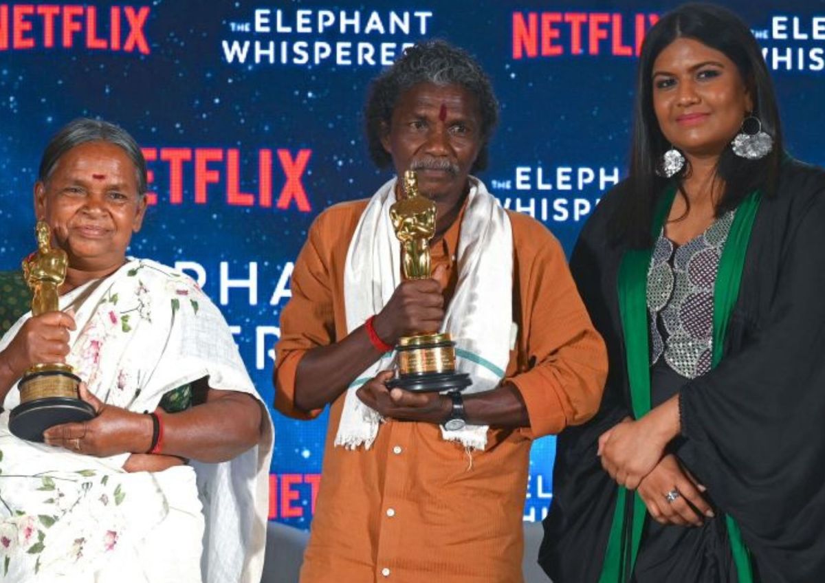(L-R) Protagonists of Oscar winning Documentary short "The Elephant Whisperers" Bellie (2L), Bomman (2R) and Indian filmmaker Kartiki Gonsalves pose with the Oscar during a press conference in Mumbai