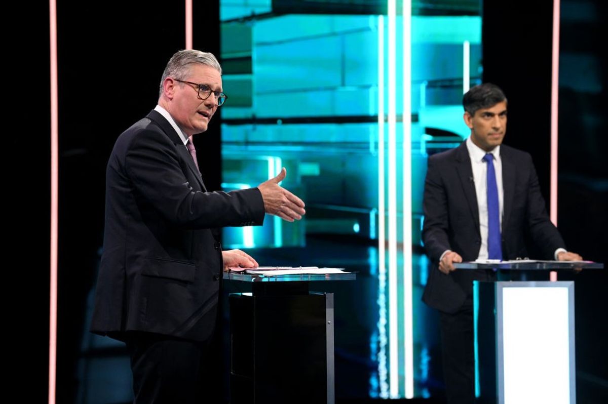 Labour Party leader Keir Starmer (L) and prime minister Rishi Sunak speak on stage during a TV debate ahead of July 4 election