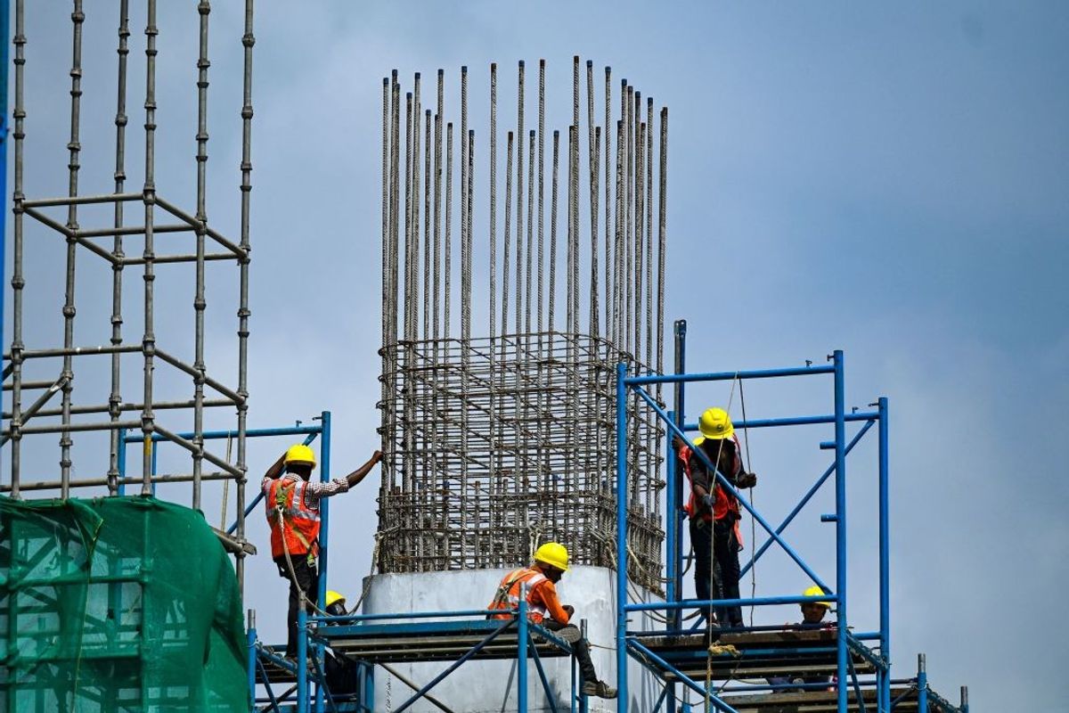 Labourers work at the Coastal Road Project construction site in Mumbai, India.