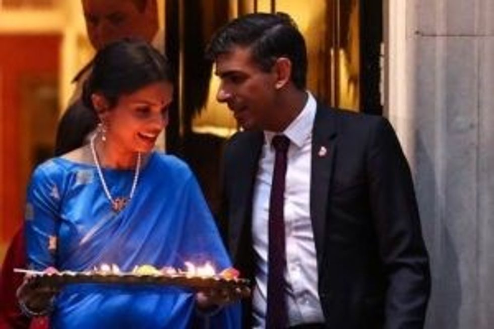 LEAD NEW Rishi Sunak Akshata Diwali lamp GettyImages 1778802268