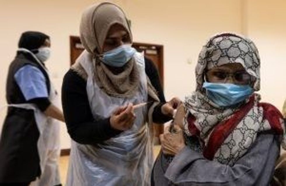 LEAD Ramadan INSET Vaccine GettyImages 1308950788