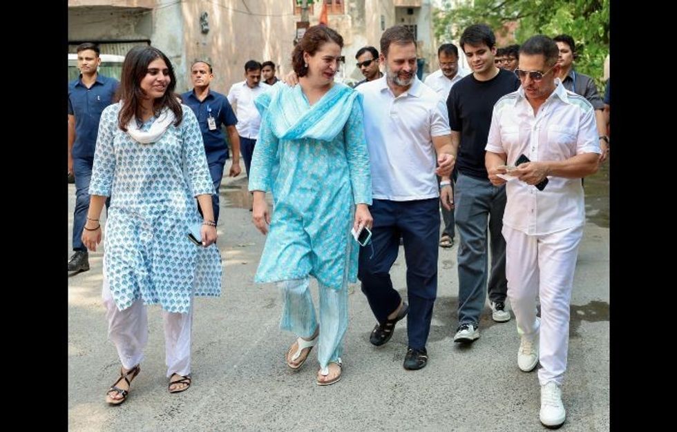 Leaders of India's opposition Congress Rahul Gandhi on way to casting ballots in general elections with his sister Priyank Gandhi Vadra (in blue) and her family.